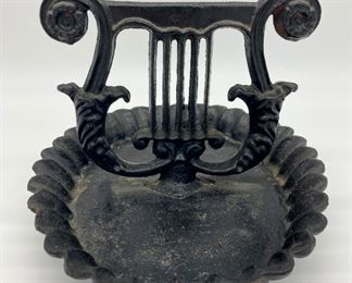 Antique cast iron lyre and pan boot scraper