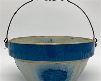 Blue and white floral pottery bowl with handle