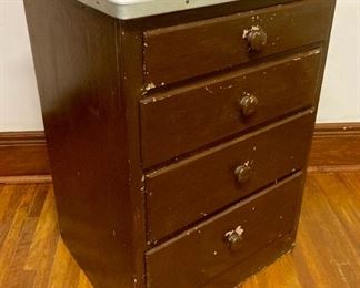 Antique 4-drawer aluminum-edged formica top cabinet