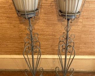 Vintage painted metal plant stands with plastic flower pots