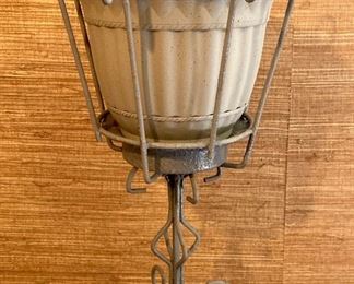 Vintage painted metal plant stands with plastic flower pots