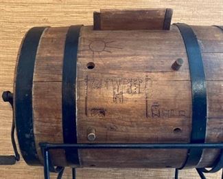 Antique wooden hand crank washing machine with iron stand