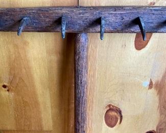 Primitive wood and cast iron rake