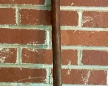 Antique cast iron and wood adjustable length rake by Hinkel Industries