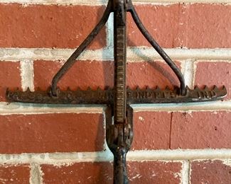 Antique cast iron and wood adjustable length rake by Hinkel Industries