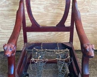 Antique wooden dog handled desk chair on casters