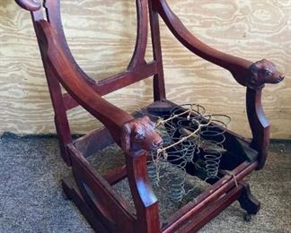 Antique wooden dog handled desk chair on casters