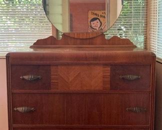 Antique dresser with round mirror