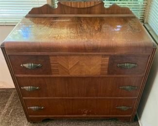 Antique dresser with round mirror