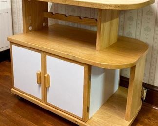 Vintage rolling kitchen island with butcher block top and storage cabinets