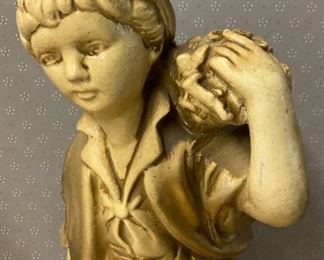 Vintage boy with basket statuette
