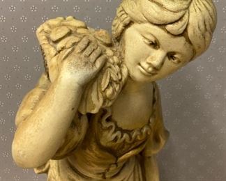 Vintage girl with basket statuette