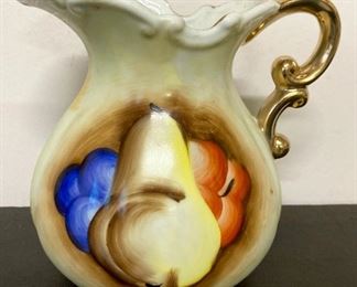 Vintage fruit-themed pitcher and wash basin