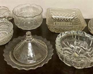 Assorted glass bowls, candy dishes, lids, and plates