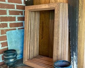 Architectural salvage including table legs, cast iron cauldrons; wooden frames