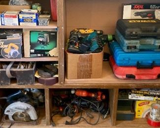 Circular saws, drills, tile saw, saber saw, boxes of nails and screws