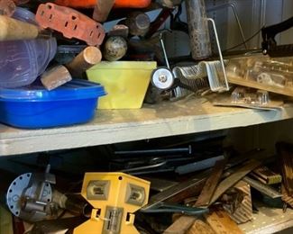 Lots of hand tools, metal pipes, electrical adapters