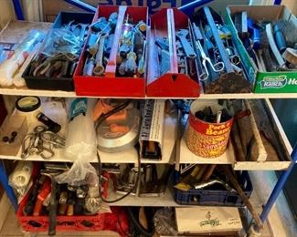 Assorted hand tools: clamps, wrenches, pliers, screwdrivers, ratchets, picks, awls, hammers, mallots, metal brushes, band saws, hand saws, trowels, and more