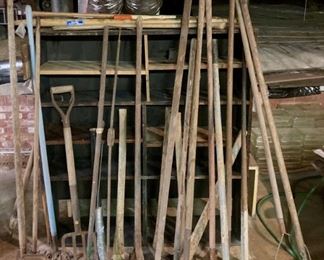 Assorted lawn & garden tools including pitchforks, shovels, rakes, edgers, hoes, etc.
