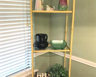 Tall metal open shelf with glass shelves