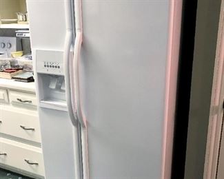 Whirlpool side-by-side refrigerator.  Works great!