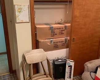 Vintage folding chairs, luggage, keyboard, paper shredder, Christmas trees