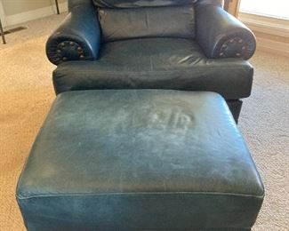 blue leather arm chair and ottoman