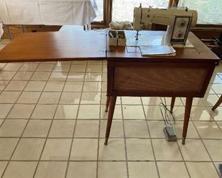 vintage Kenmore Model 54 sewing machine in MCM cabinet