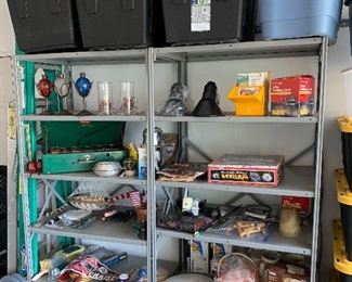 Coleman camp stove, metal shelving, plastic storage bins, gardening tools, Red Wings pennant, games