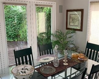 Metal / glass dining table with padded chairs