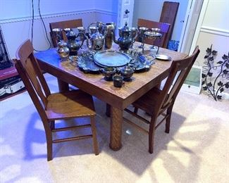 Gorgeous antique oak table with multiple leaves, table top protector, and four chairs. Antique tea pots, trays, cream and sugar sets