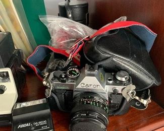 Vintage Canon camera, flash, and extra lens