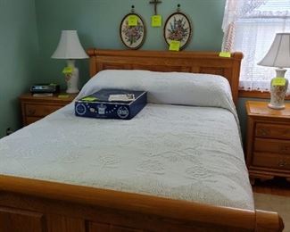 Oak queen bed with head and foot board.