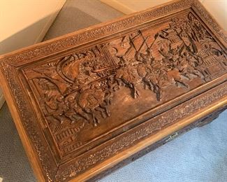 Beautifully carved antique camphor wood trunk with a stunning battle scene. Chinese / oriental 