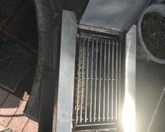 Outdoors single grill that connects directly to a propane tank for use.