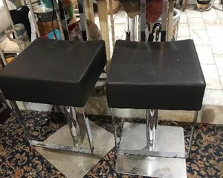 Set of 2 mid century modern black leather and chrome adjustable chairs/bar stools