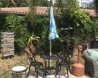 Wrought Iron table and chairs set.    Also outdoors table with marble top which is not included with the table set with umbrella but listed seperately.