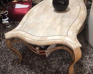 Coffee table with metal legs and pieces of inlaid marble.  4'L x 30" W x 18"H