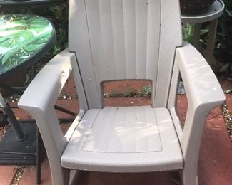 Set of 2 outdoor rocking chairs.    Molded, heavy plastic 