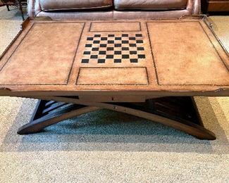 $600 - 2 drawer leather top game wood coffee table featuring stenciled gold leaf highlights (top is in great condition, normal wear noted on the base - minor condition issues, study and functional) - 47 x 31 x 16