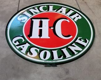 Sinclair H-C Gasoline porcelain 2 sided 72" diameter sign dated 1956. With a factory cast iron frame with chain hook.  It is in very good condition.