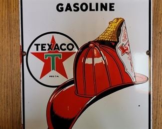 Texaco Fire-Chief Gasoline 1950's Heavy Metal Painted Sign. It measures 12" by 18" and it's in Very Good condition with a very few pits at the edges.