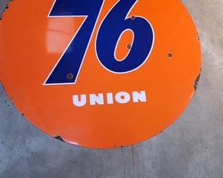 An original 76 Union Porcelain 1-sided 59" Diameter Sign. The condition is good with 6 pits, several chips and several chips around the edges.