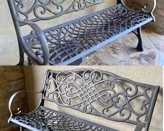 pair of matching cast aluminum benches