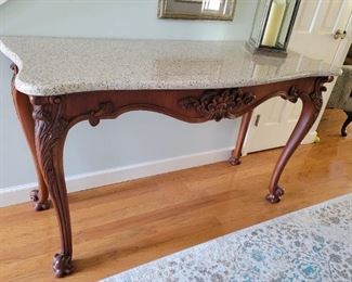 Wood carved table with granite top