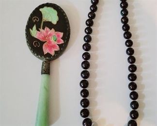 Pearls, jade hand mirror