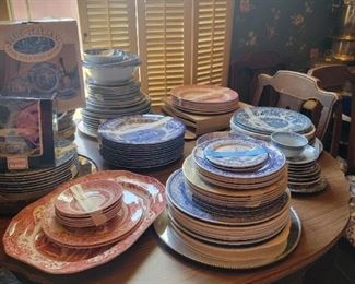 Many different blue and white plate sets 