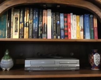 Living Room - Books in cabinet & decor on shelf with DVD player