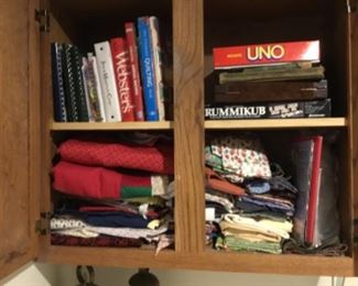 Entryway off garage - in cabinets - games, cookbooks & fabric + a few patterns