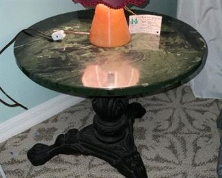 Heavy marble top iron base table. Gorgeous wood turned lamp.